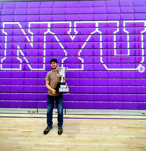 Trophy in hand at the NYU gym